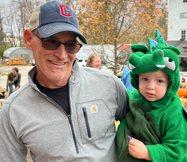 A man and grandson attending an event at White's Mill.