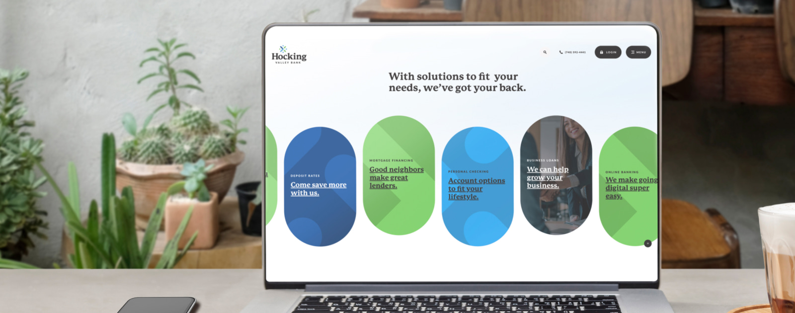 laptop with the bank's website homepage on the screen